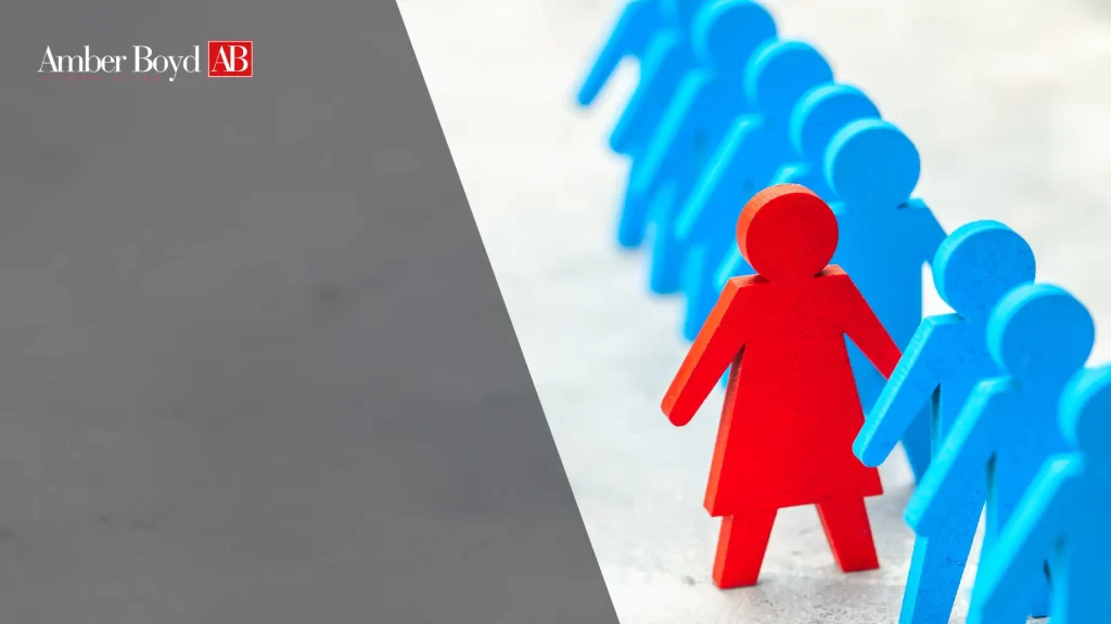 Red leadership figure leads a row of blue figures, with the Amber Boyd AB logo in the top-left corner.