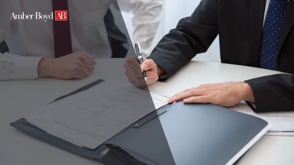 How to Get Out of a Non-Compete Agreement in Indiana - Amber Boy - Amber Boy Indiana employee reviewing a signed non-compete agreement with an attorney