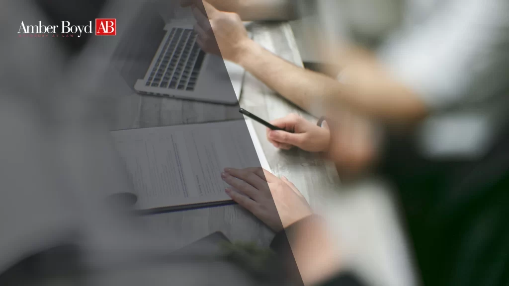 Indiana worker reviewing pay stubs to document wage theft