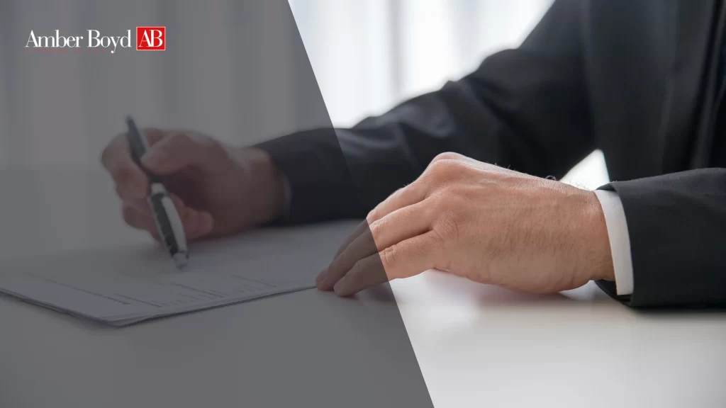 Misclassification 1099 vs W-2 in Indiana Lawsuits and Recovery - Amber Boy - Amber Boy Indiana worker comparing a 1099 form and W-2 form with an employment attorney