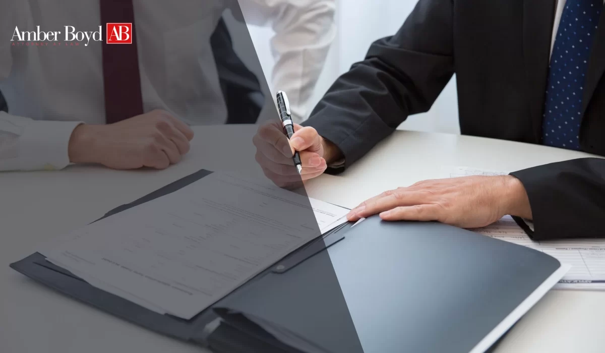 Indiana employee reviewing a signed non-compete agreement with an attorney