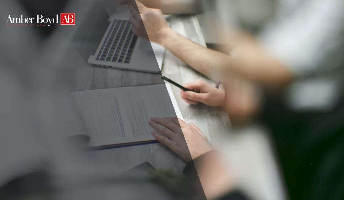 Indiana worker reviewing pay stubs to document wage theft